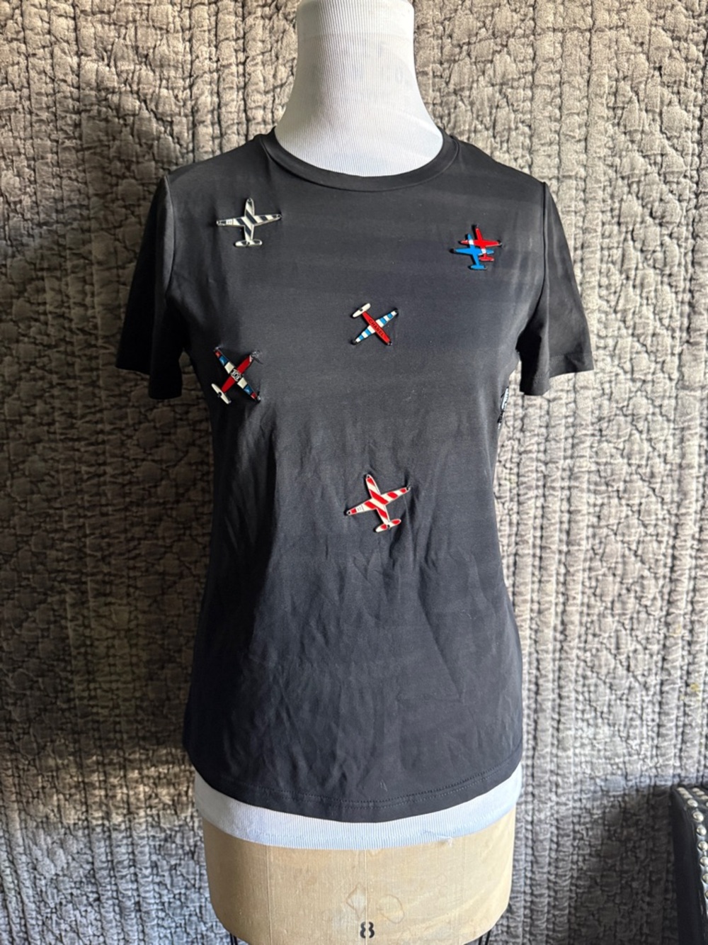 Women’s Black Short Sleeve Tee with Airplane Embellishments.Chanel airplane